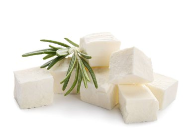 Pieces of delicious feta cheese with rosemary on white background clipart