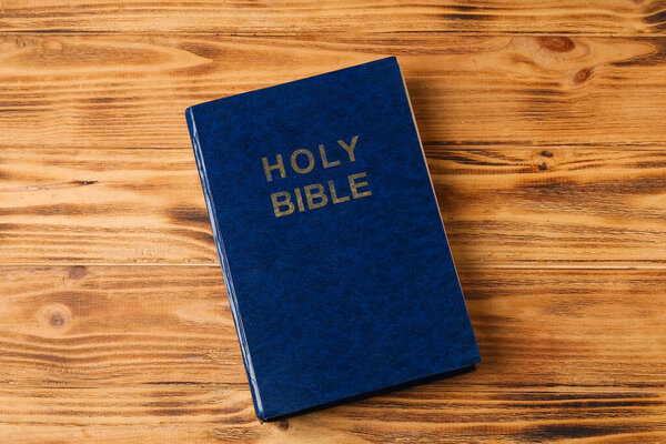 Holy Bible on wooden background