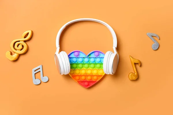 Pop Juguete Inquieto Auriculares Notas Música Fondo Color — Foto de Stock