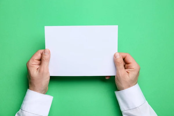 Man Holding Blank Sheet Paper Color Background Closeup — Stock Photo, Image