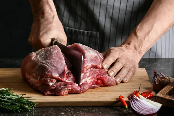 Man Cutting Raw Pork Meat Dark Background Closeup — Stock Photo, Image