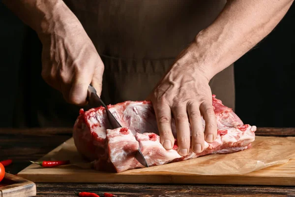 Man Cutting Raw Pork Ribs Wooden Table Closeup — Stock Photo, Image