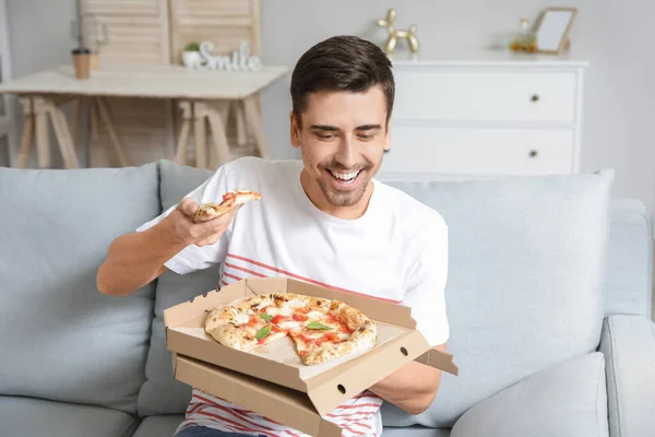 Young Man Eating Tasty Pizza Home — Stock Photo, Image