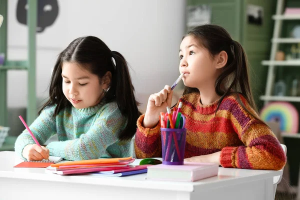 Cute Asian Sisters Doing Homework Table — Stock Photo, Image