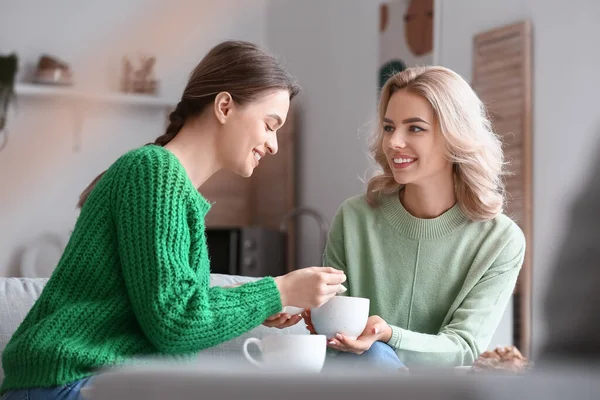 Beautiful Young Sisters Drinking Tea Home — Stock Photo, Image