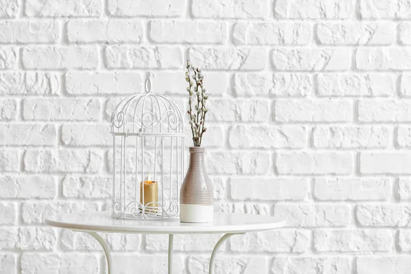 Vase Willow Branches Burning Candle Table Brick Wall — Stock Photo, Image