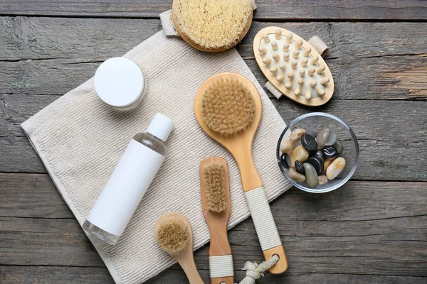 Different Massage Brushes Bath Supplies Wooden Background — Stock Photo, Image