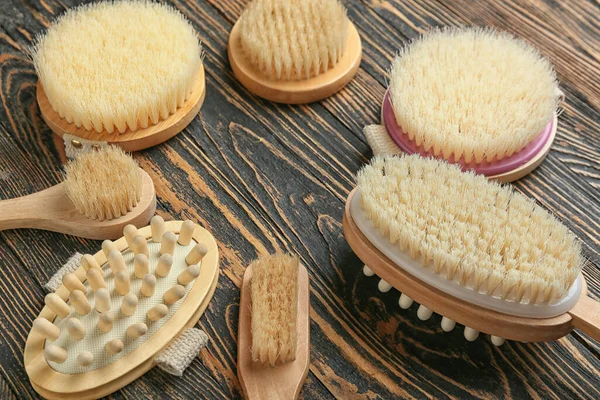 Different Massage Brushes Wooden Background — Stock Photo, Image