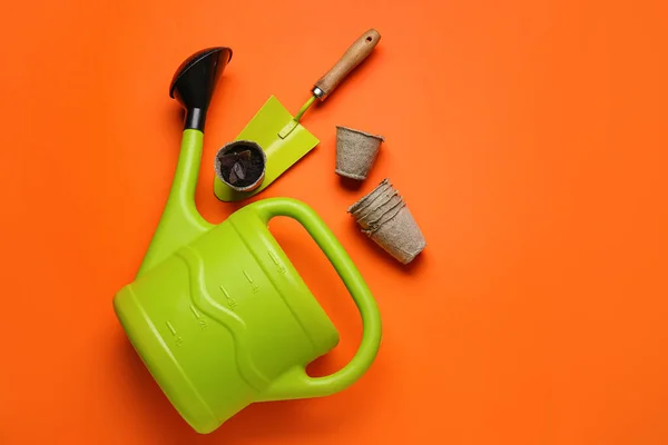 Watering Can Peat Pots Gardening Shovel Soil Color Background — Stock Photo, Image