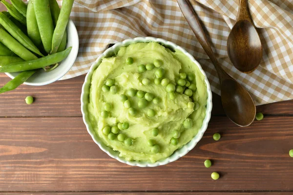 Bowl Mashed Potatoes Green Peas Spoons Wooden Background — Stock Photo, Image