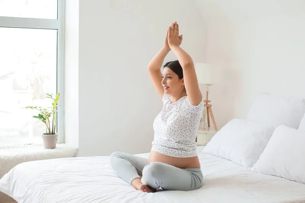 Young Pregnant Woman Practicing Yoga Bedroom — Stock Photo, Image