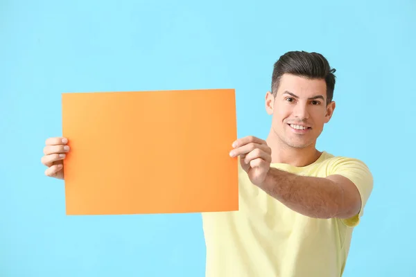 Young Man Blank Paper Sheet Color Background — Stock Photo, Image