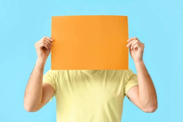 Young Man Blank Paper Sheet Color Background — Stock Photo, Image