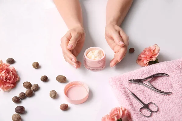 Female Hands Jar Shea Butter Nuts Tools Manicure Flowers White — Stock Photo, Image