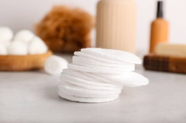 Cotton pads on light background, closeup
