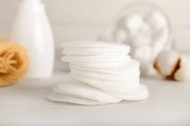Cotton pads on light background, closeup