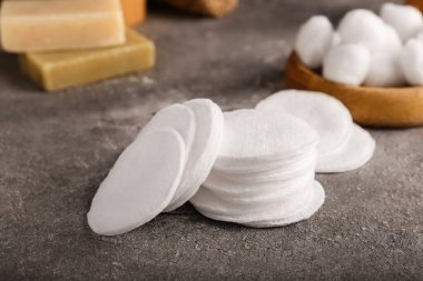 Cotton pads on grunge table, closeup