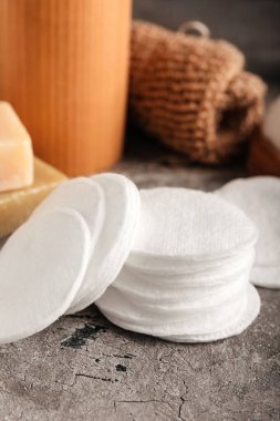 Cotton pads on grunge table, closeup