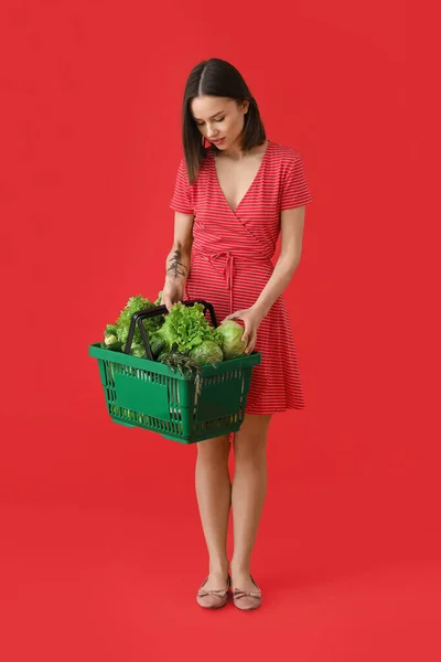 Young Woman Shopping Basket Fresh Vegetables Color Background — Stock Photo, Image