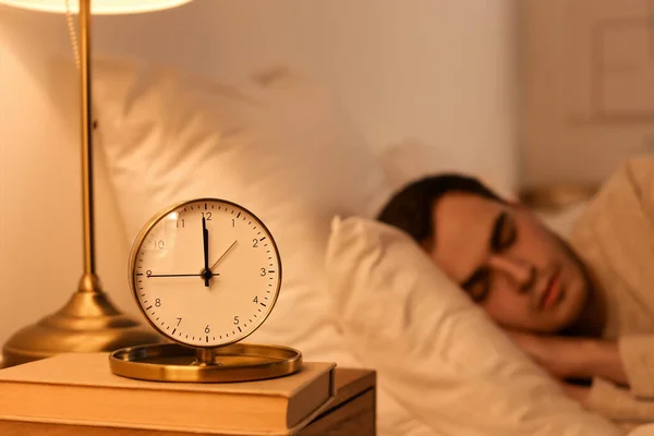 Alarm Clock Table Sleeping Young Man Bedroom Night — Stock Photo, Image