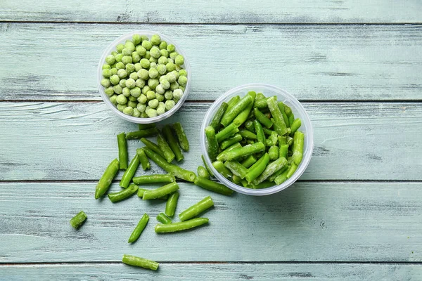 Containers Frozen Green Peas Beans Color Wooden Background — Foto de Stock