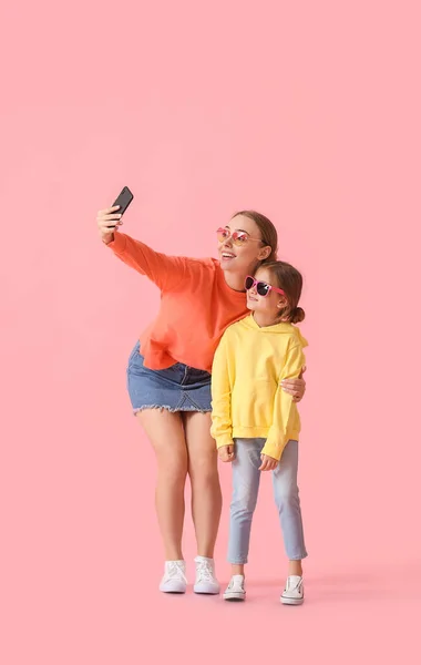 Young Woman Her Little Daughter Taking Selfie Color Background — Stock Photo, Image
