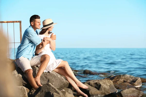 Happy young couple on sea beach