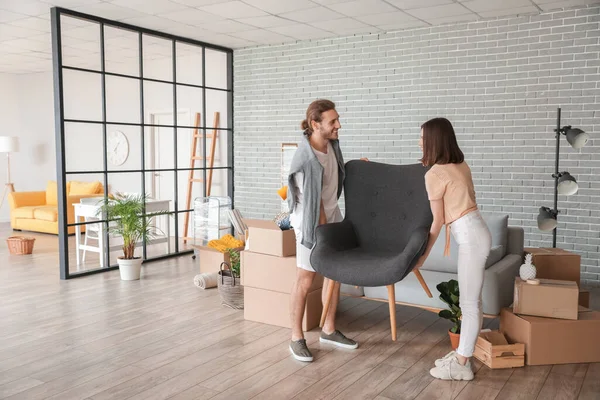Young Couple Carrying Armchair Room Moving Day — Stock Photo, Image