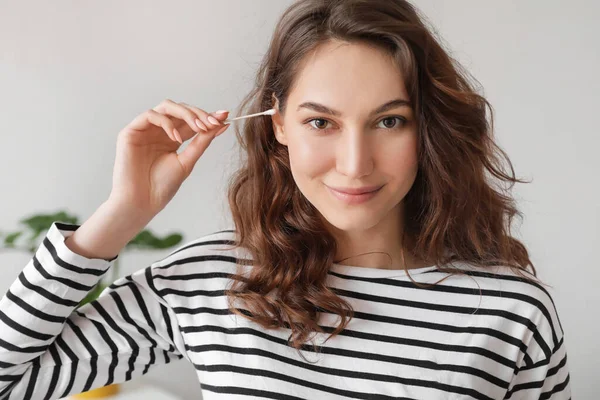 Young Woman Cleaning Ears Cotton Bud Home — Stock fotografie