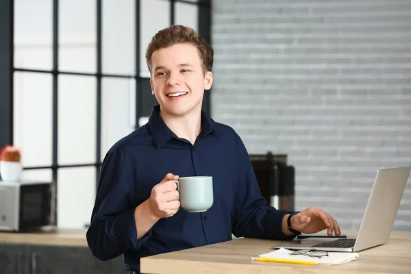 Young Man Drinking Coffee While Using Laptop Home — Stock Photo, Image