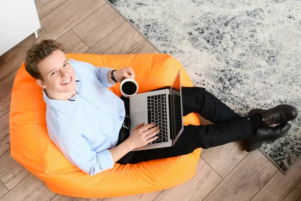 Young Man Drinking Coffee While Using Laptop Office — Stock Photo, Image