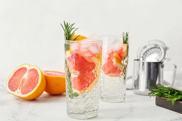 Glasses Tasty Grapefruit Cocktail Rosemary Light Background — Stock Photo, Image