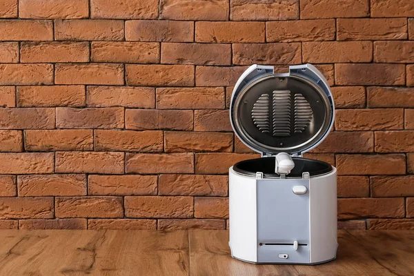 Modern Deep Fryer Table Brick Wall — Stock Photo, Image