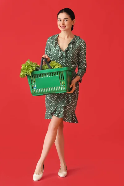 Young Woman Holding Shopping Basket Fresh Vegetables Color Background — Stock Photo, Image