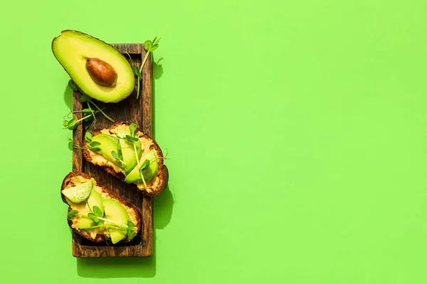 Tasty Bruschettas Avocado Hummus Color Background — Stock Photo, Image