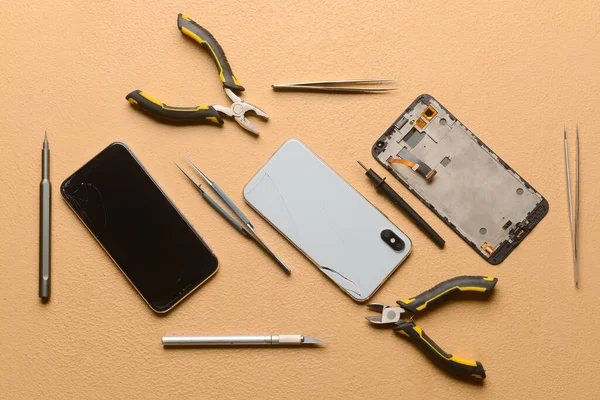Disassembled Mobile Phones Technician Tools Color Background — Stock Photo, Image