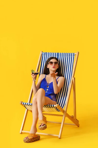 Beautiful Young Woman Cocktail Blowing Kiss While Sitting Deck Chair — Stock Photo, Image