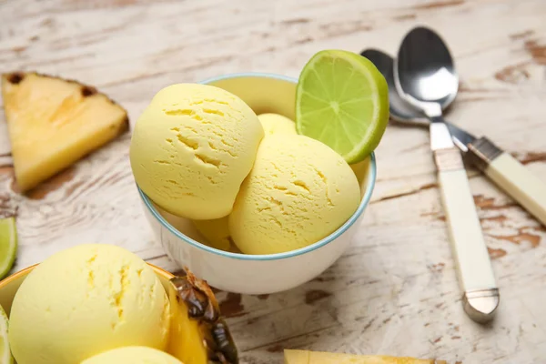 Bowls Tasty Pineapple Ice Cream Lime Light Wooden Background Closeup — Stock Photo, Image