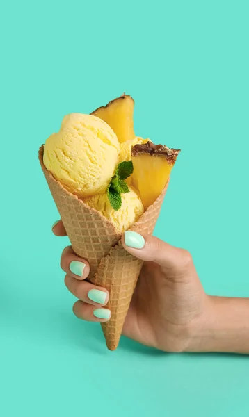 Female Hand Tasty Pineapple Ice Cream Wafer Cone Color Background — Stock Photo, Image