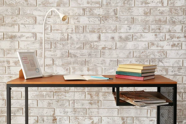 Table Books Lamp Brick Wall — Stock Photo, Image