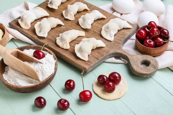Composition Raw Cherry Dumplings Color Wooden Background — Stock Photo, Image