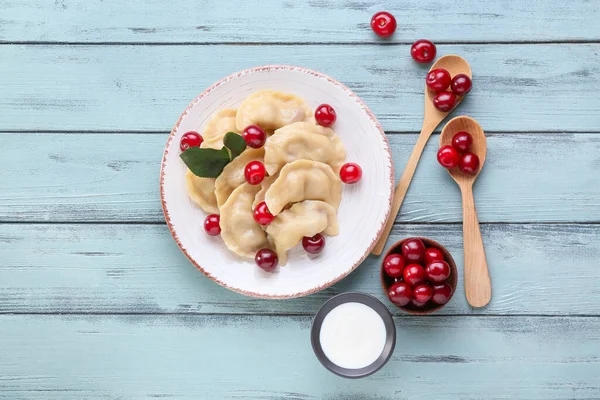 Plate Tasty Cherry Dumplings Sauce Color Wooden Background — Stock Photo, Image