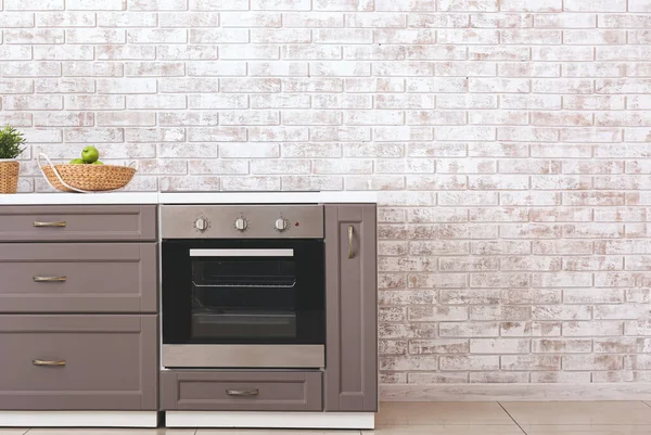 Modern Kitchen Counter Electric Oven Brick Wall — Stock Photo, Image