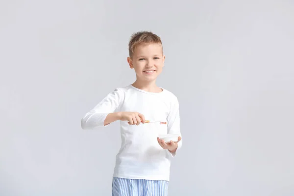 Little Boy Brushing Teeth Grey Background — Stock Photo, Image