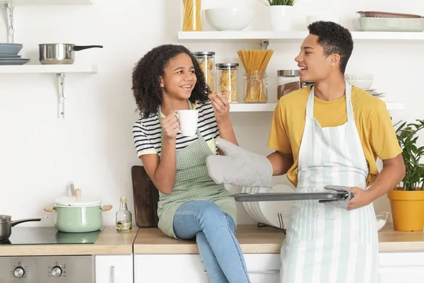 African American Brother Sister Eating Homemade Cookies Kitchen — Stock Photo, Image