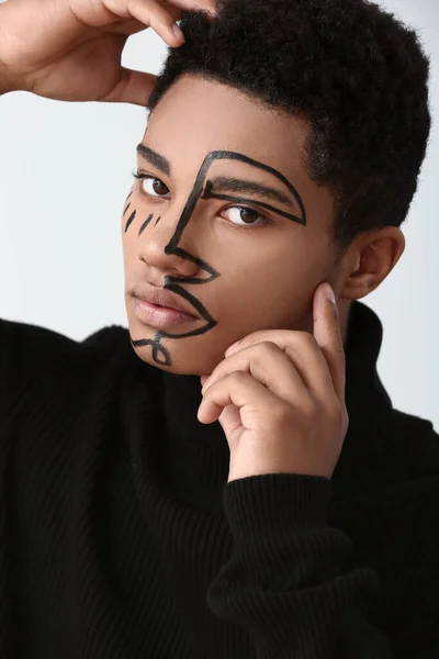 Young African American Guy Paint Face Light Background — Stock Photo, Image