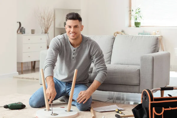 Young Man Assembling Furniture Home — Stock Photo, Image