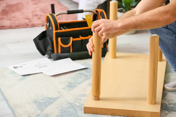 Young Man Assembling Furniture Home — Stock Photo, Image