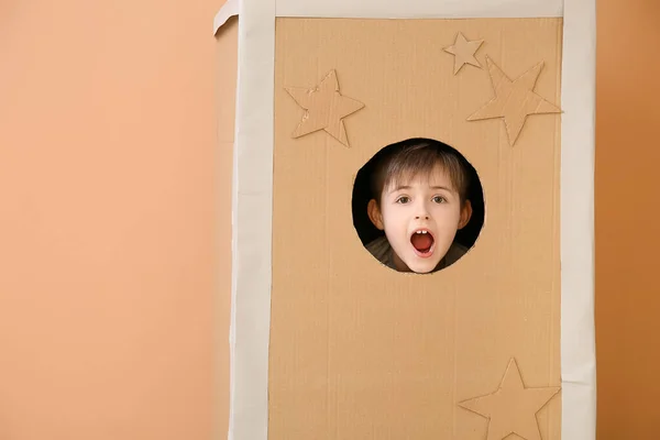 Shocked Little Boy Cardboard Rocket Color Background — Stock Photo, Image