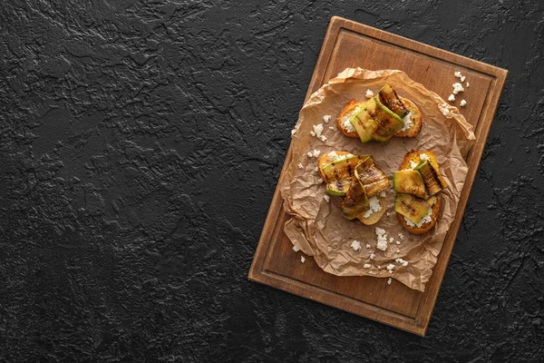 Tasty Bruschettas Cheese Grilled Zucchini Dark Background — Stock fotografie